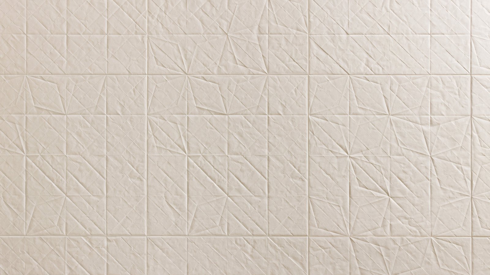 Folded porcelain surface by Mutina with paper-fold relief