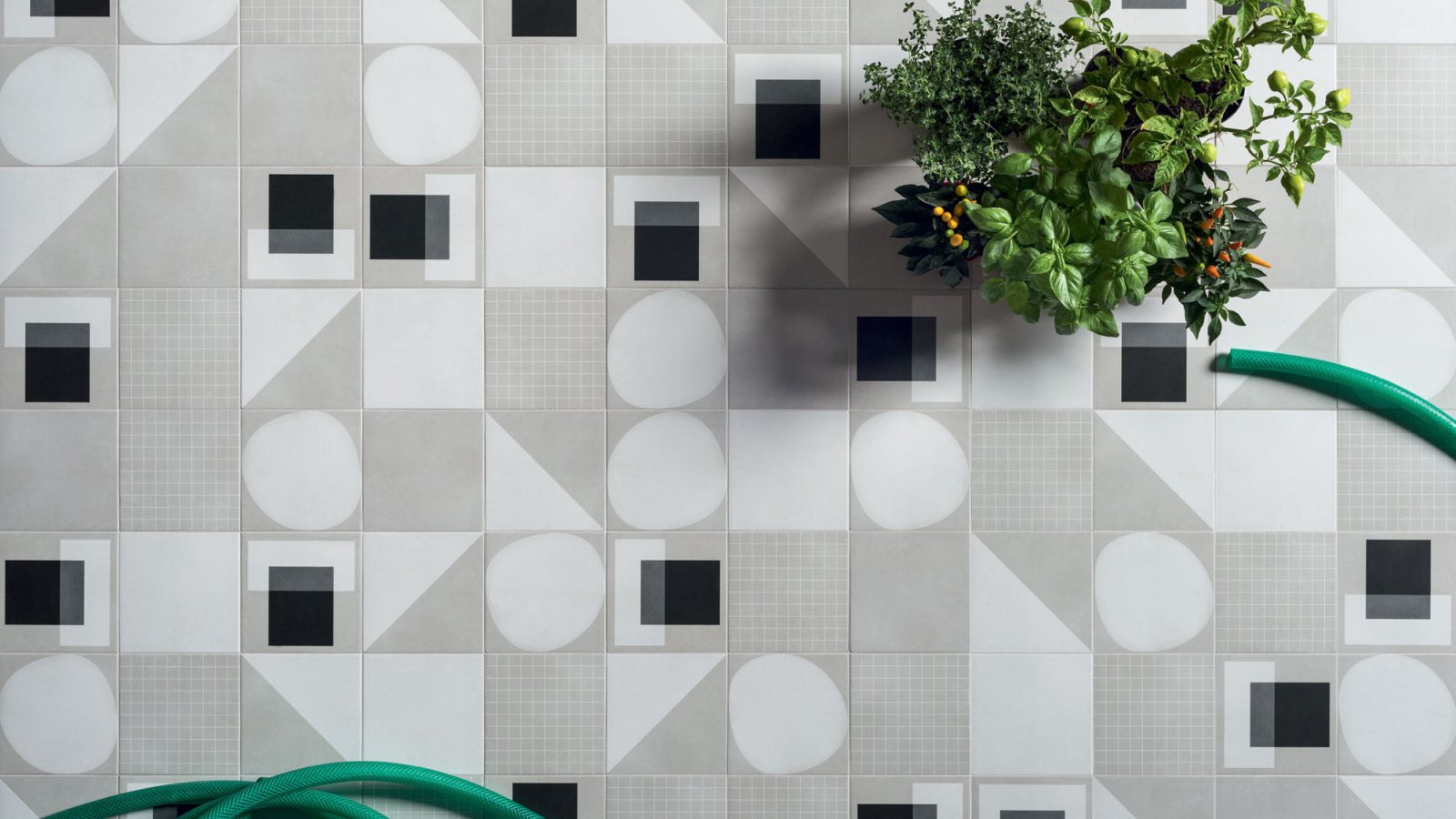 Designer ceramic tiles Futura by 41zero42 in 15x15 cm on an office washroom wall