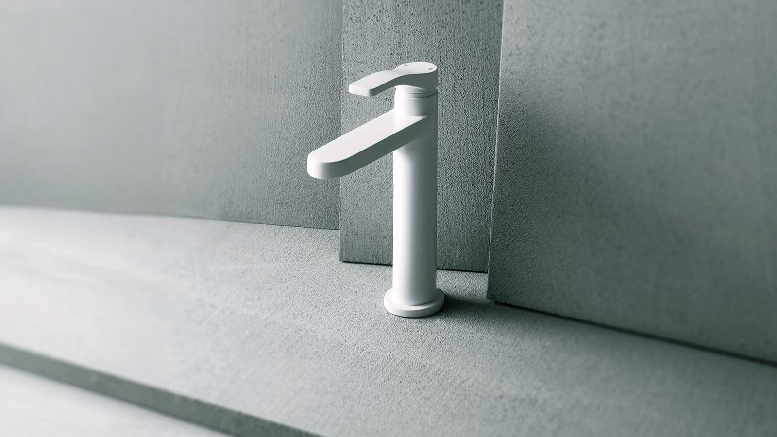 Chrome-finished Fantini AL/23 basin mixer photographed against a grey concrete slab