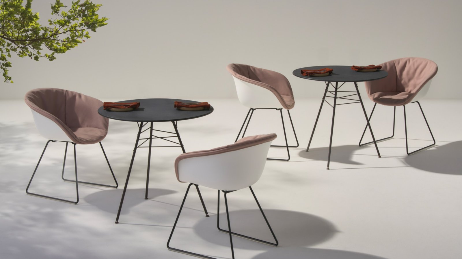 Leaf design chair by Arper with leaf-vein steel structure in a lounge