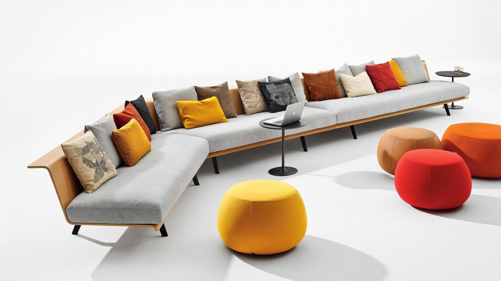Arper Zinta modular seating with wooden shell in a hotel reception