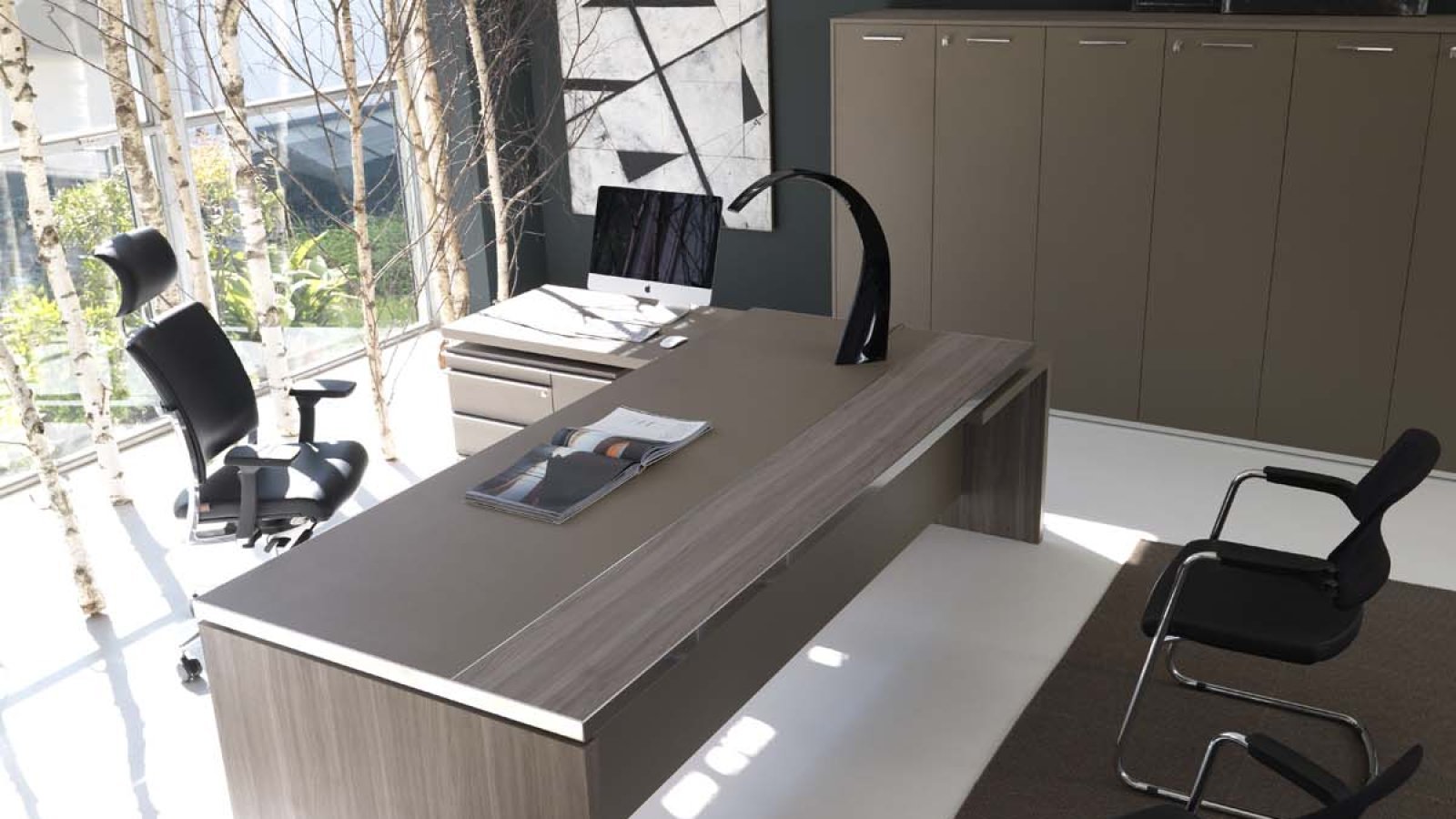 Athos executive desk by IVM in an MD cabin with guest overhang top