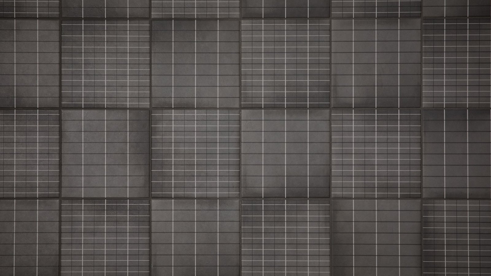 Washroom wall in Aurore Charcoal Grid L porcelain tile by Mutina
