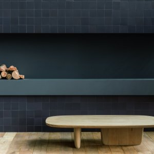 Waiting lounge with Mews Chalk floor and rattan chairs
