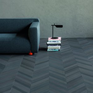 Mutina Mews porcelain in Ink laid in herringbone across a Mumbai office lobby