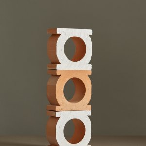Jali Bianco glazed block beside natural clay