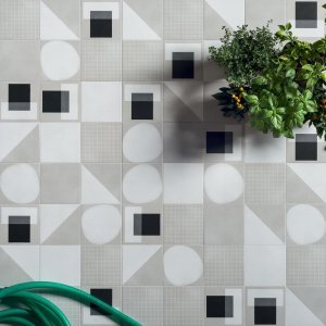 Designer ceramic tiles Futura by 41zero42 in 15x15 cm on an office washroom wall