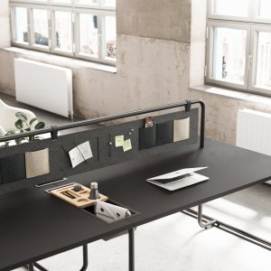 Side screen resting on circular supports, Itube collection