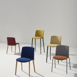 Fully upholstered Mixu design chair by Arper in a hotel lounge