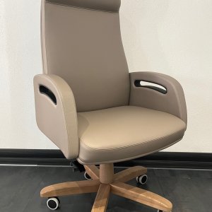 Semi-oval iSixty conference table for nineteen with full-height leather back