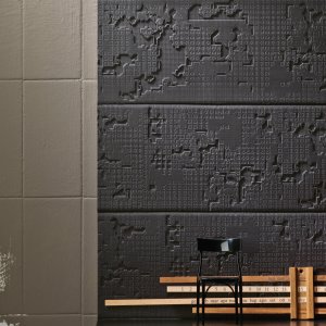 Light raking across Bas-Relief carving
