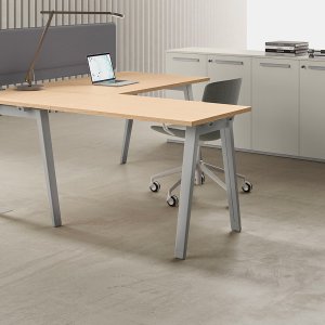 Trapezoidal modesty panel under an E-Place workstation