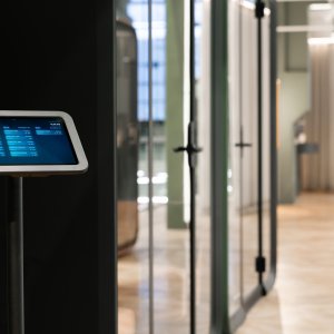 Framery One Compact pod beside open plan workstations