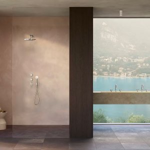 Horizontal row of Flora controls on the wall above a bath