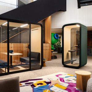 Team of four meeting inside the Framery Four pod