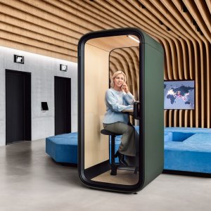 Framery One Compact interior with laptop on the birch table