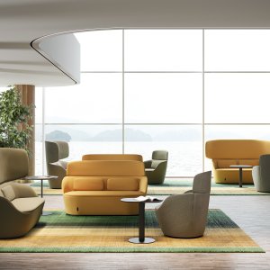 Triangular Radar pouf between two armchairs