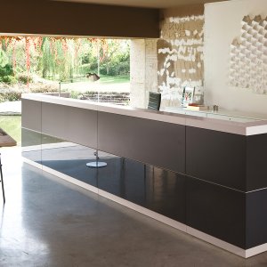 Vogue reception desk in greenish grey lacquer with light elm panels