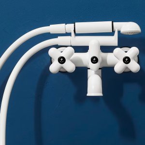 White matt version of the I Balocchi basin mixer on light stone