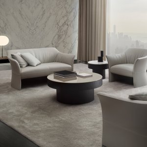 Wide low Sella table in front of the sofa