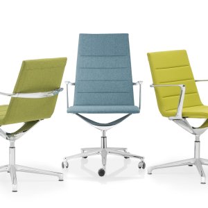 Stacked Valea visitor chairs in a training room corner