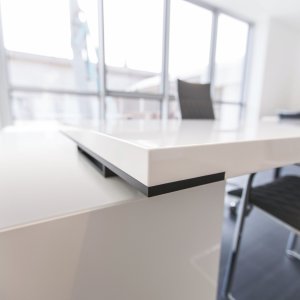 Dark brown elm laminate top on the New Loop executive desk