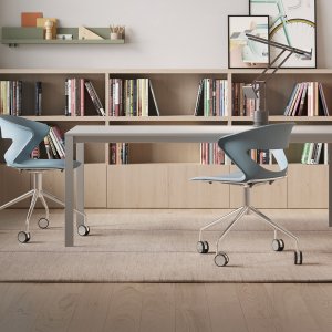 Lava coloured polypropylene shell on a Kicca chair, three-quarter view