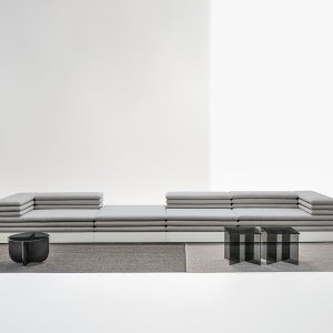 Acamante two-seater sofa where the base carries the upholstery of the cushions