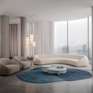 Apper armchair from the side: the back stays low and rolls into the armrest