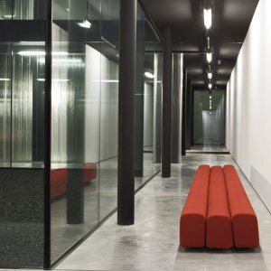Serpentine composition of Osaka sofas by Pierre Paulin in a bank lobby