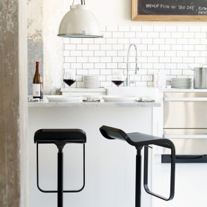 Curved plywood seat of the LEM stool in oak