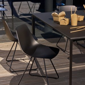 Miunn stools along a hotel bar counter