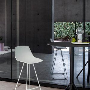 Miunn sled-base chair beside a dining table