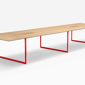 Bridge leg of the Toa table opening into a T under the laminate