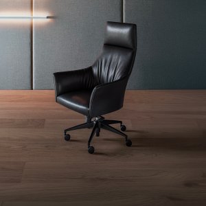 Leather-wrapped side panel of a Sella table