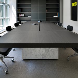 Stabilizer plates inside the base of an oval Asymmetrical Meeting table